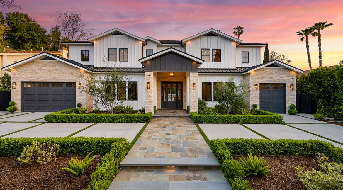 Modern single-story home in Conejo Valley with lush landscaping and solar panels, 2025.